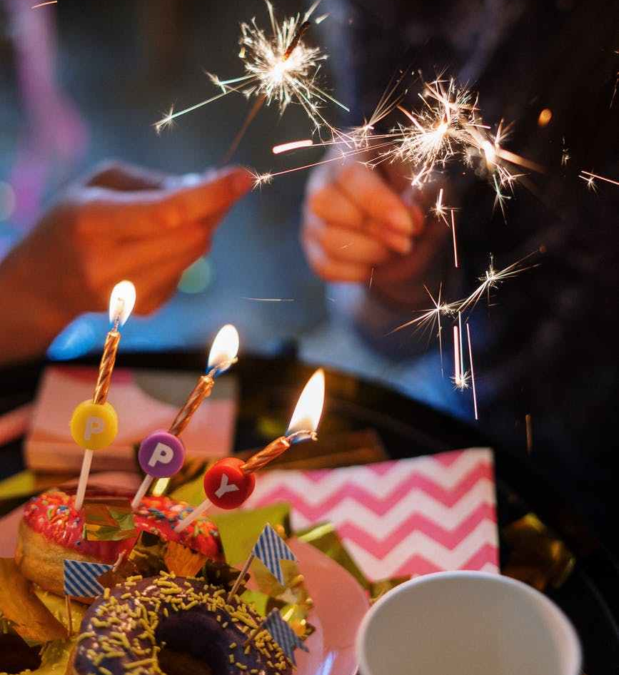 person holding lighted sparkler stick
